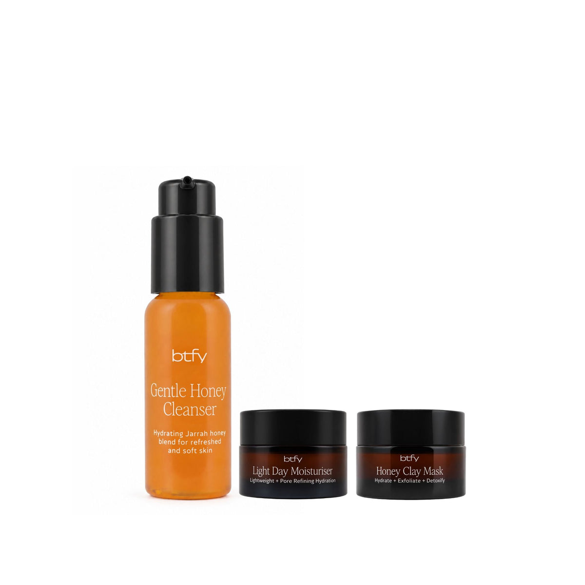 BTFY Honey Traveller Kit with travel-sized Gentle Honey Cleanser in a pump bottle, Light Day Moisturiser and Honey Clay Mask in amber glass jars