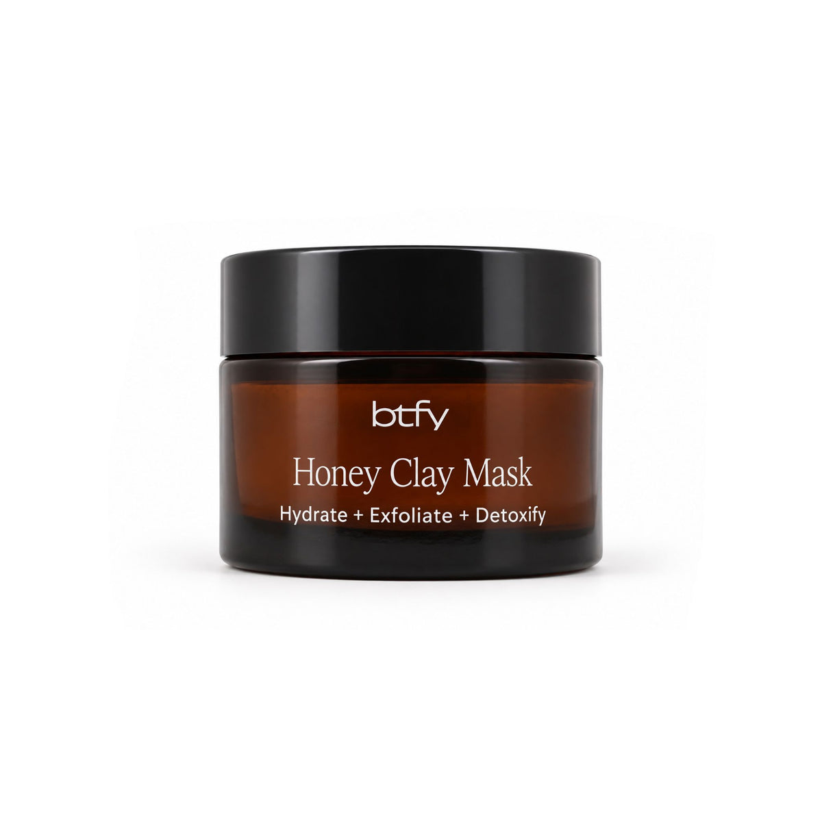 BTFY Honey Clay Mask 50ml in an amber glass jar with a black lid, to hydrate, exfoliate and detoxify